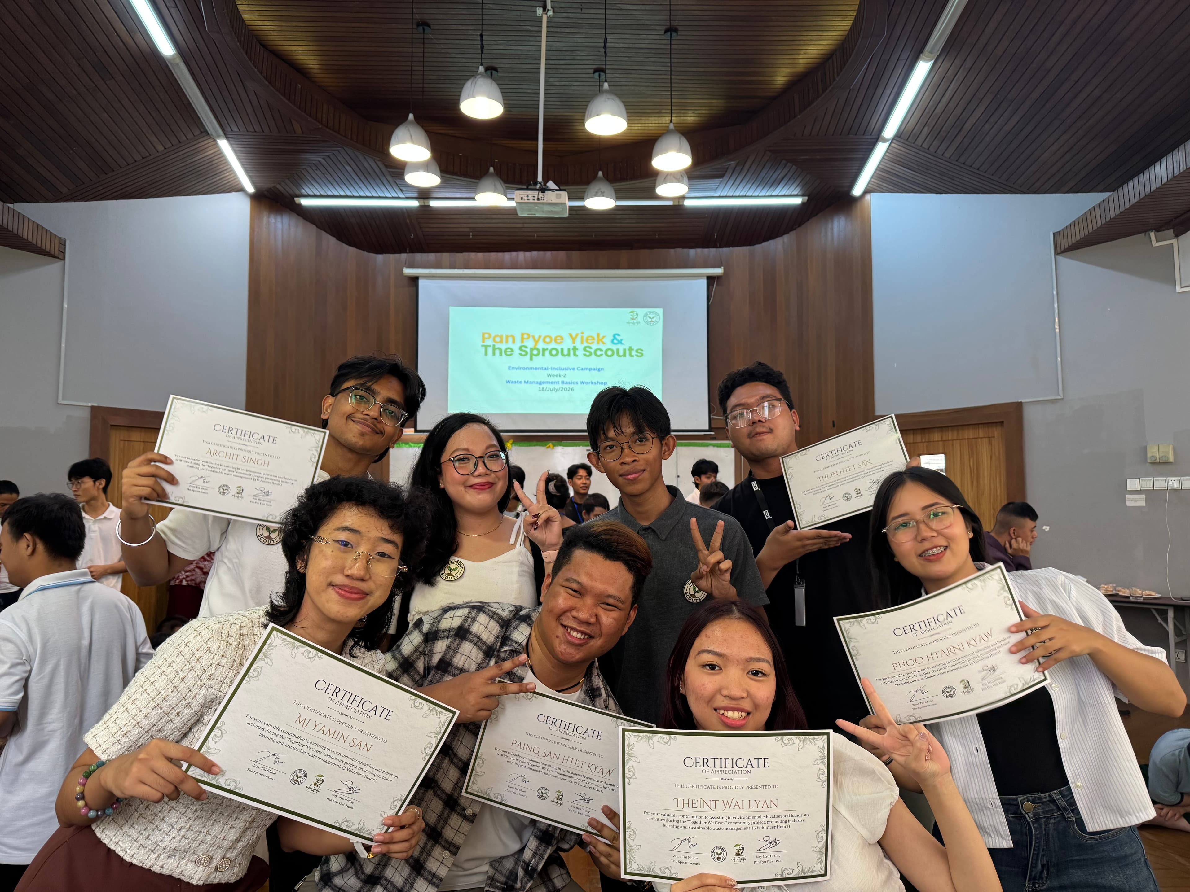 Volunteers holding certificates of appreciation after the workshop